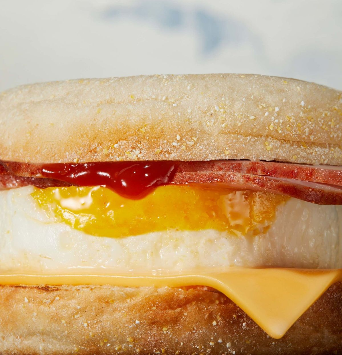 Bacon and egg toasted sandwich with Easy Heat hot sauce