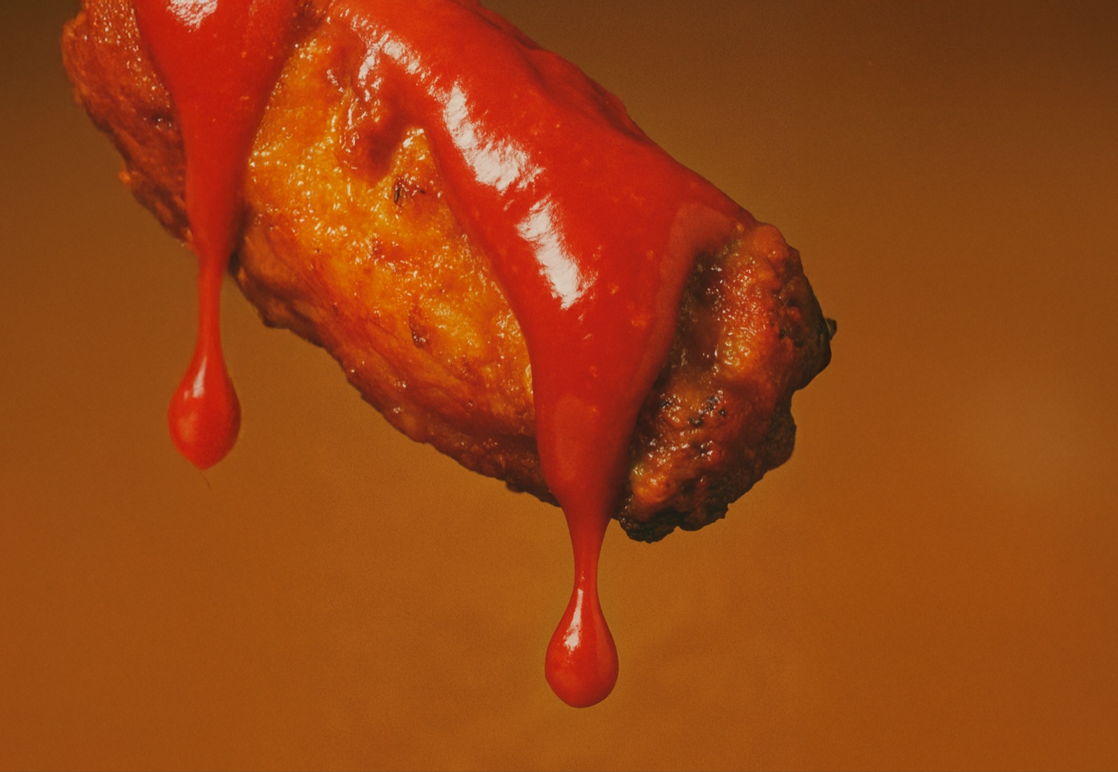 Easy Heat hot sauce drizzled over fried chicken